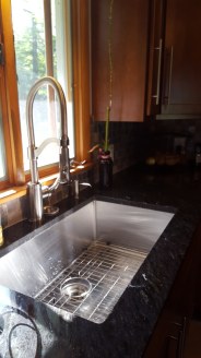 Nice large single bowl sink with industrial faucet takes care of ALL of your needs!
